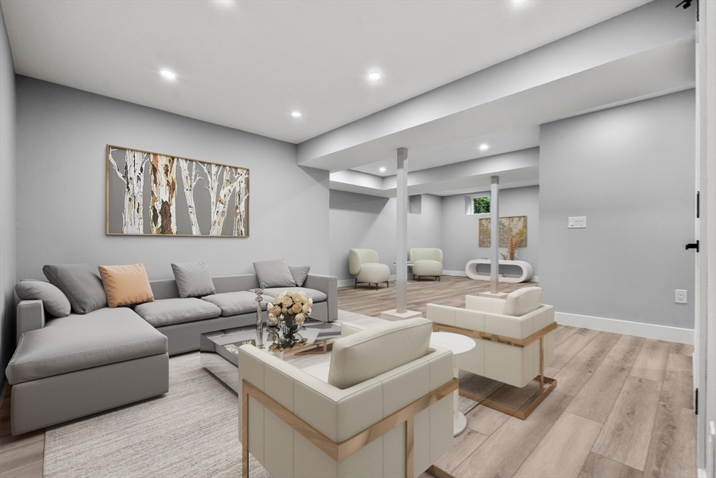 121 Oliver Road Belmont, MA 02478 - Photo 30 of 34 a living room with furniture a wooden floor and potted plant