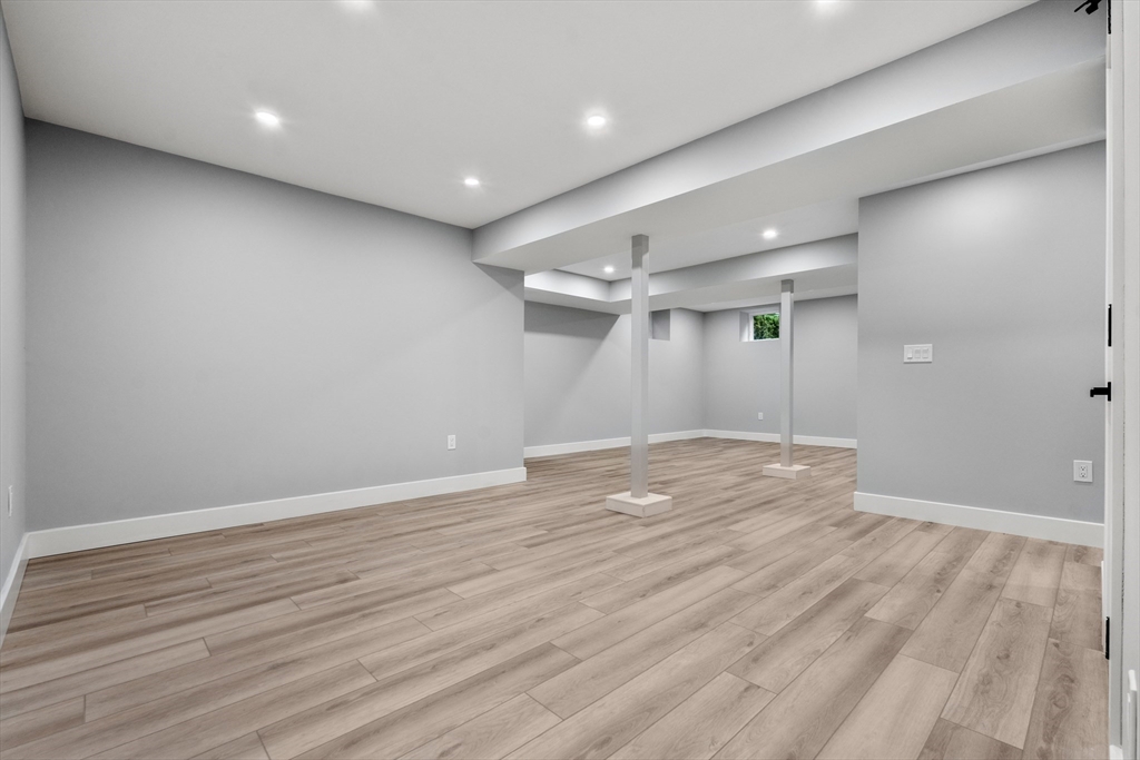 121 Oliver Road Belmont, MA 02478 - Photo 31 of 34 an empty room with wooden floor and windows