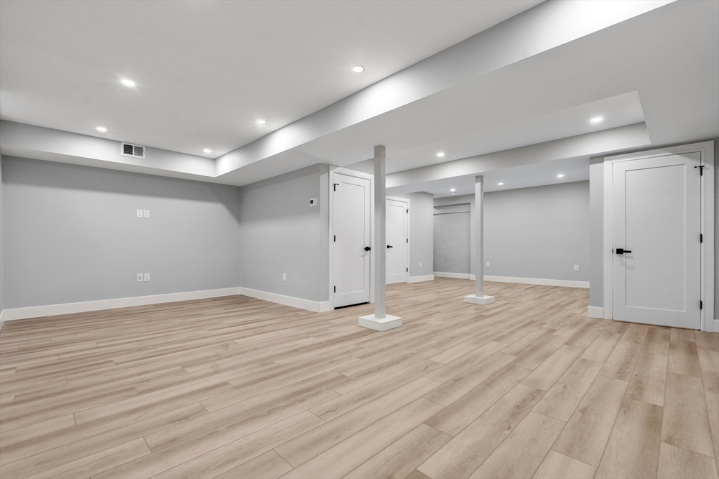 121 Oliver Road Belmont, MA 02478 - Photo 32 of 34 a view of an empty room with wooden floor