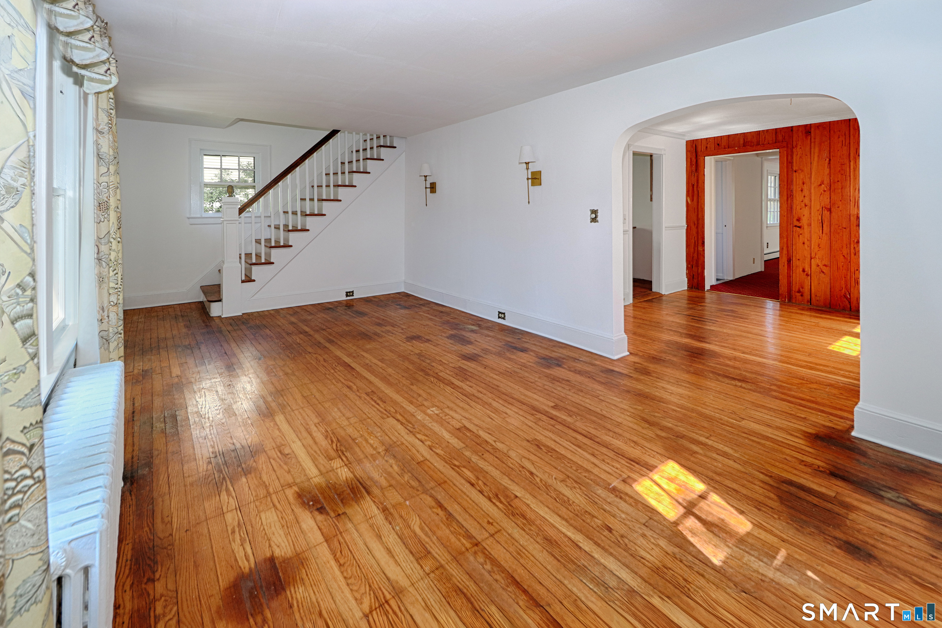 104 Henderson Road Fairfield, CT 06824 - Photo 6 of 26 The living room is open to the dining room.