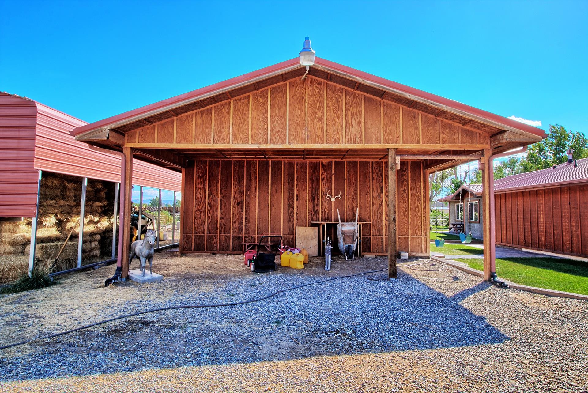 967 18 Road Fruita, CO 81521 - Photo 11 of 39 a backyard of a house with barbeque oven table and chairs