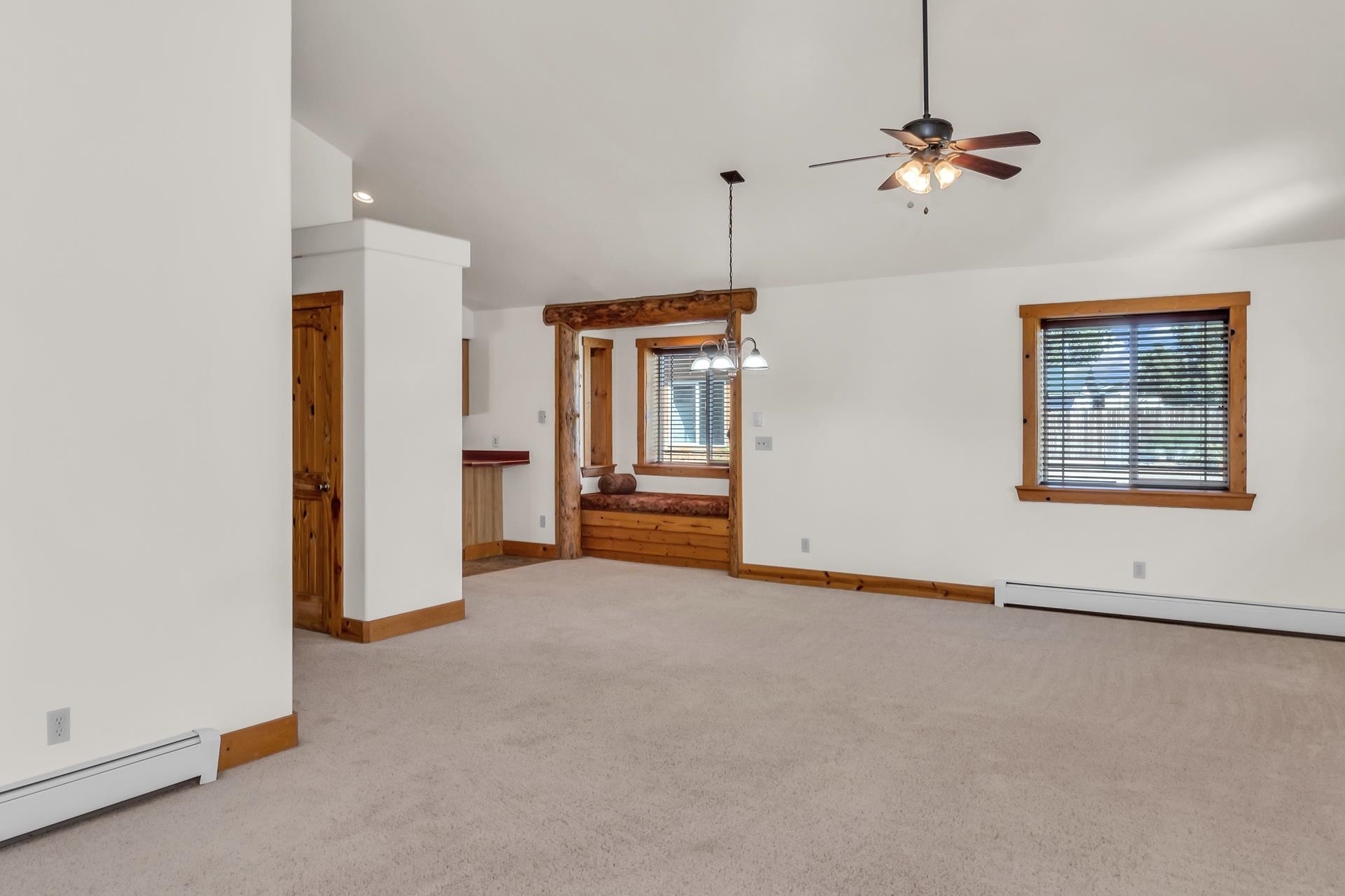 967 18 Road Fruita, CO 81521 - Photo 21 of 39 an empty room with chandelier fan and windows