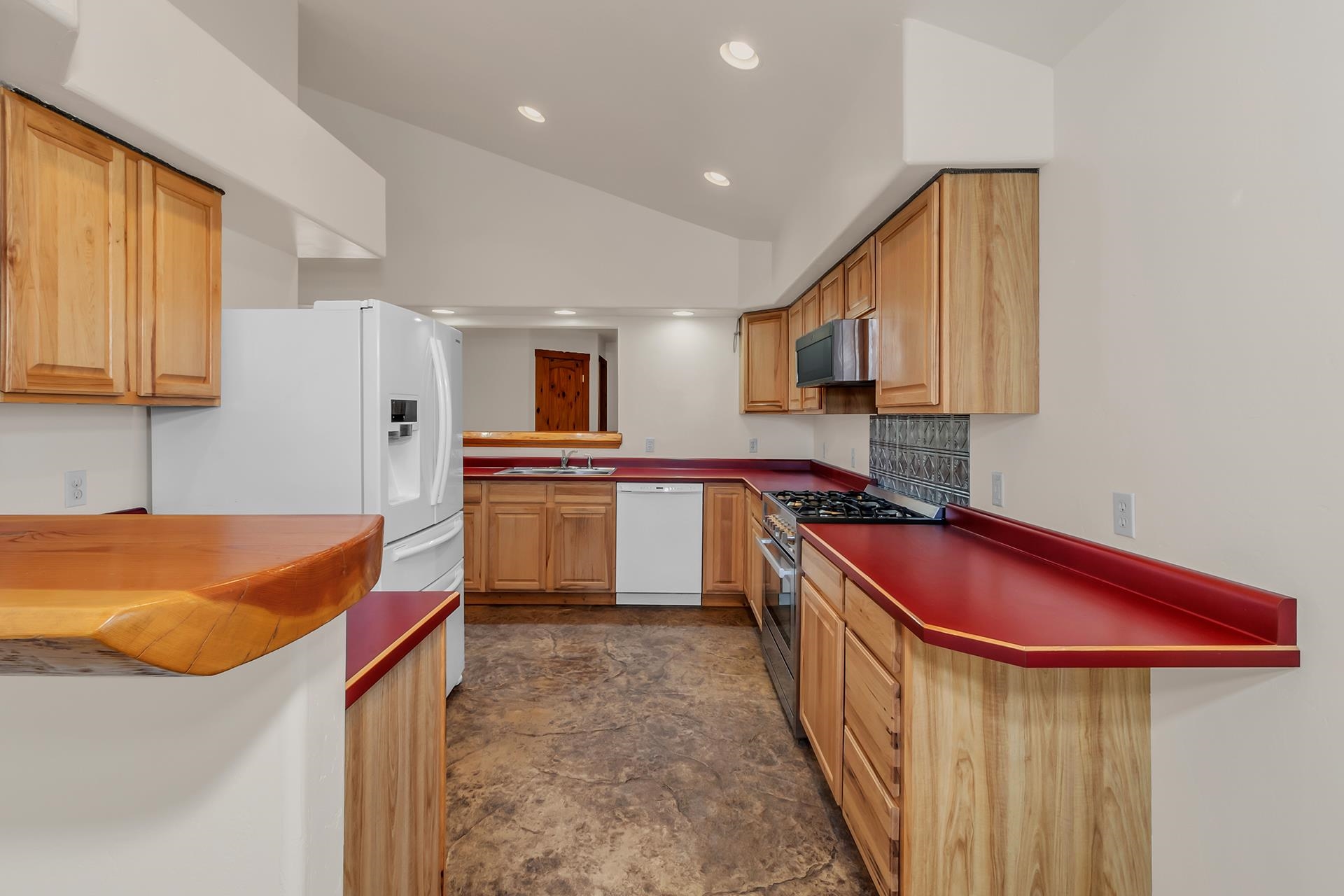 967 18 Road Fruita, CO 81521 - Photo 23 of 39 a kitchen with stainless steel appliances granite countertop a sink stove and cabinets