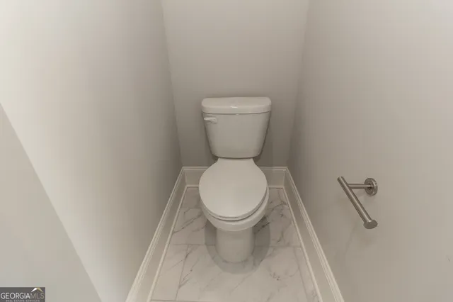 a view of staircase with wooden floor and a large window