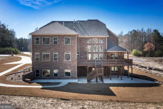 a kitchen with granite countertop a stove and wooden floor