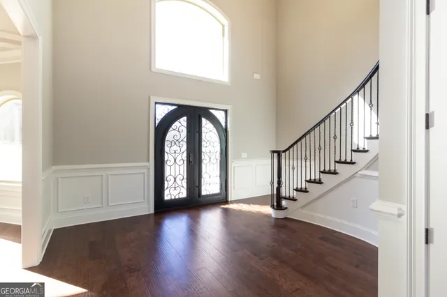 a view of an empty room with a fireplace and a window