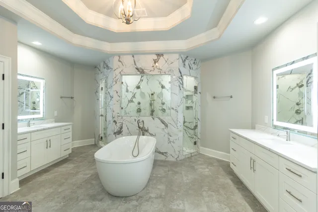 a white toilet sitting next to a white cabinet