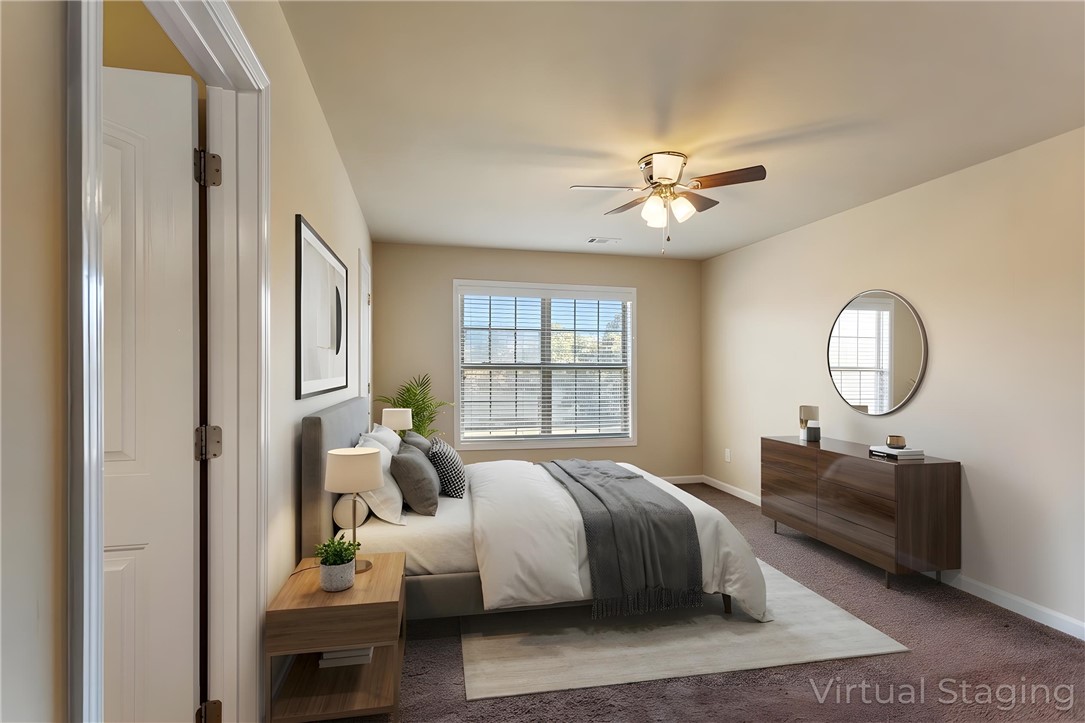 1005 Winmar Drive Anderson, SC 29621 - Photo 10 of 50 This spacious bedroom offers ample light and comfort.