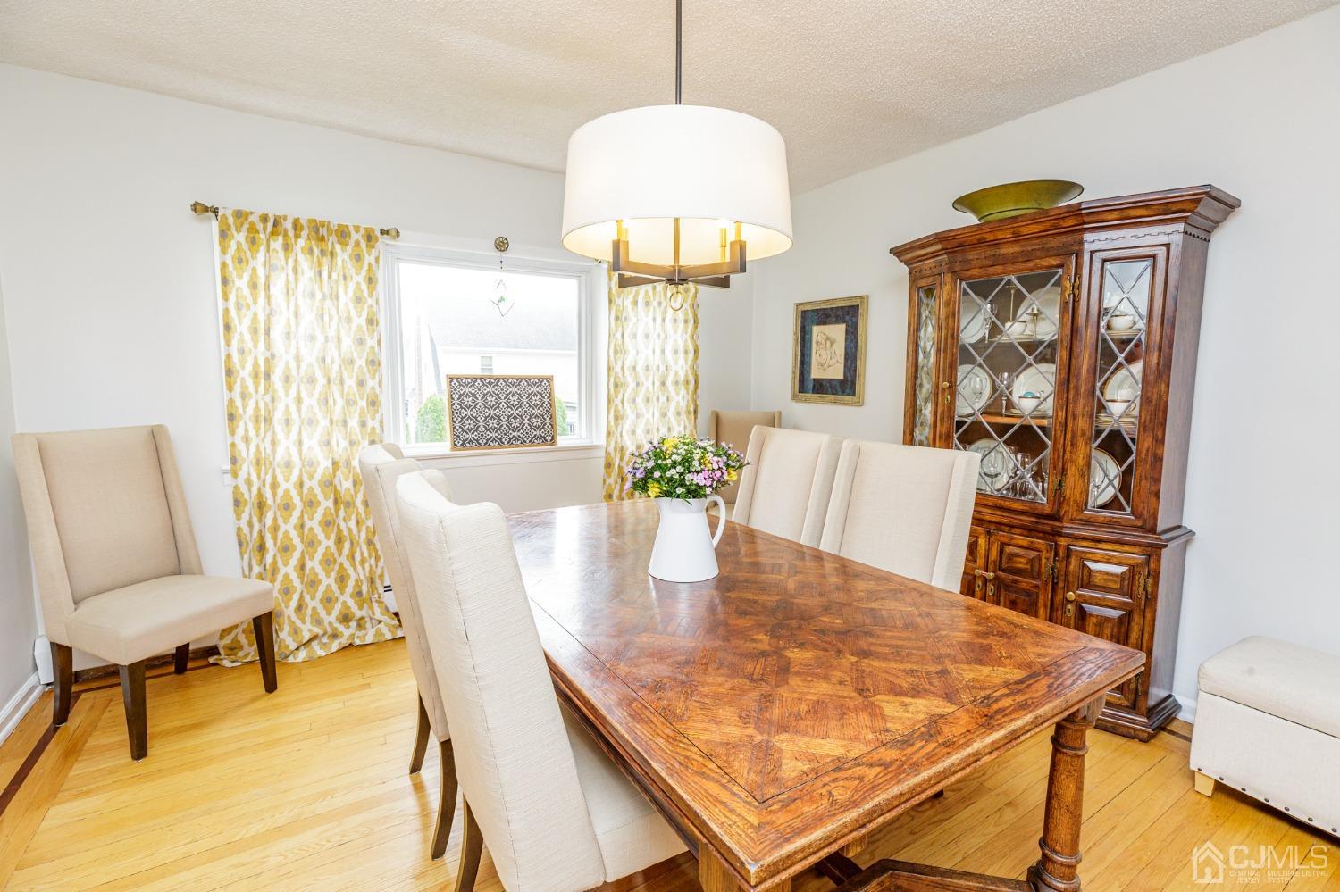 215 Hillside Road Elizabeth, NJ 07208 - Photo 13 of 37 a view of a dining room with furniture and a potted plant