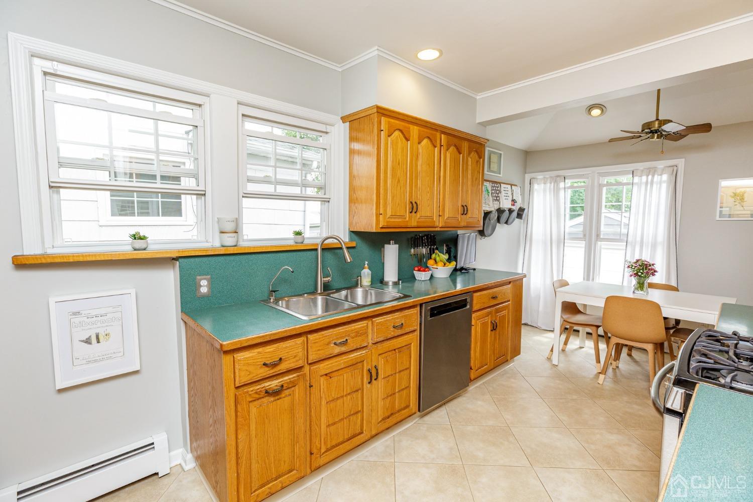 215 Hillside Road Elizabeth, NJ 07208 - Photo 14 of 37 a kitchen with stainless steel appliances granite countertop a sink and cabinets