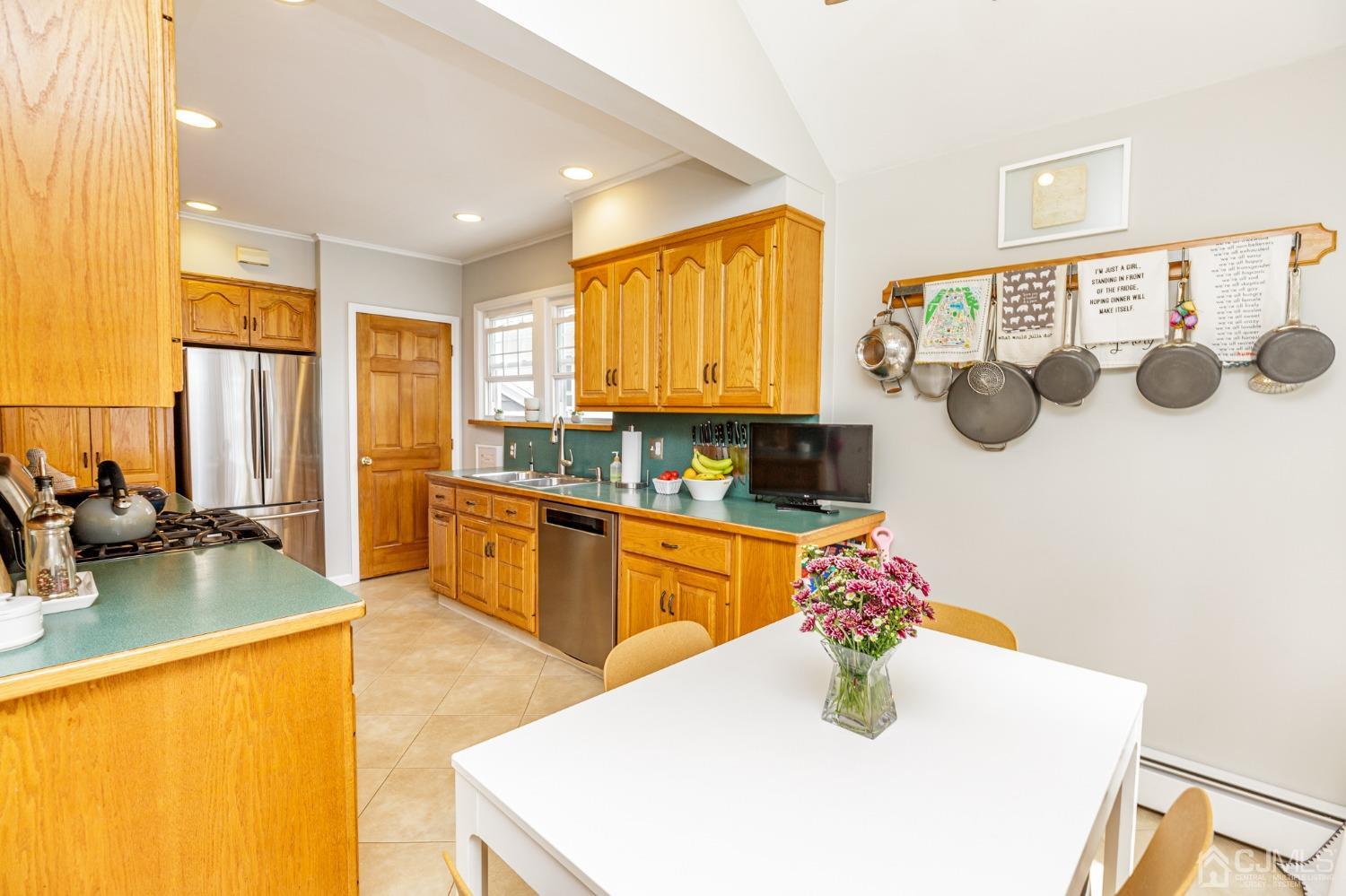 215 Hillside Road Elizabeth, NJ 07208 - Photo 16 of 37 a kitchen with granite countertop a sink and a stove top oven