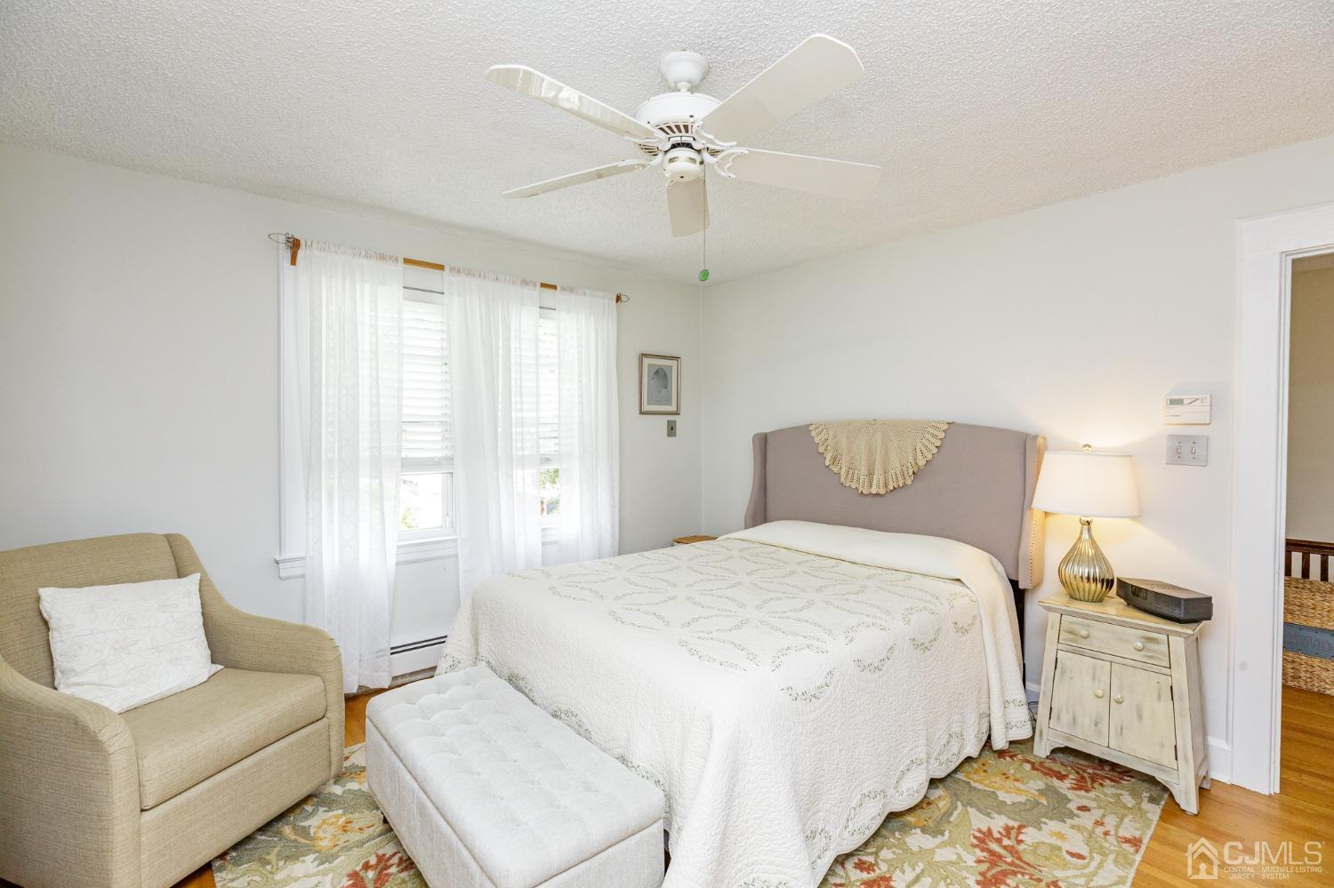 215 Hillside Road Elizabeth, NJ 07208 - Photo 21 of 37 a spacious bedroom with a bed and a couch