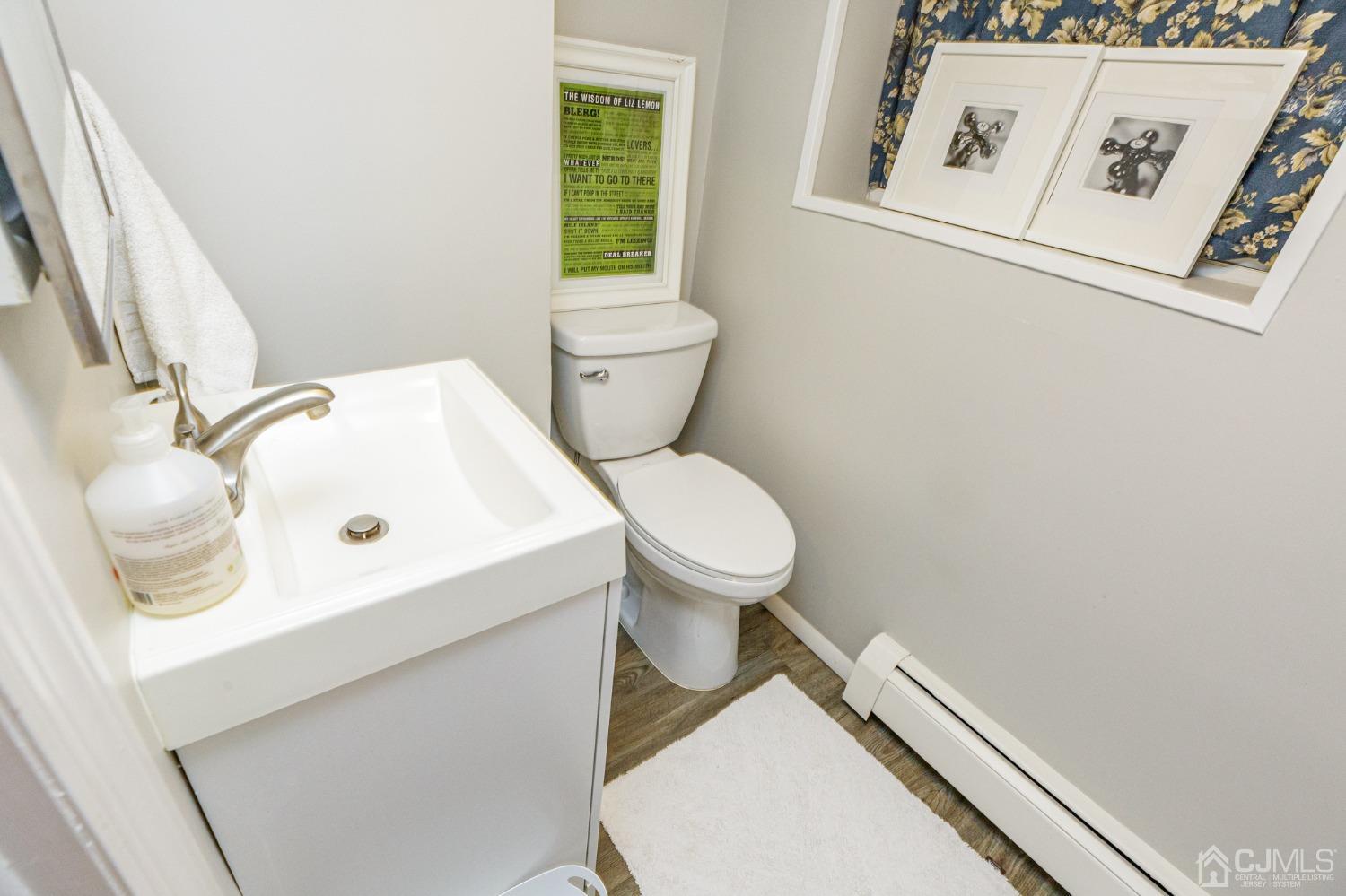 215 Hillside Road Elizabeth, NJ 07208 - Photo 29 of 37 a white toilet sitting next to a bathroom sink