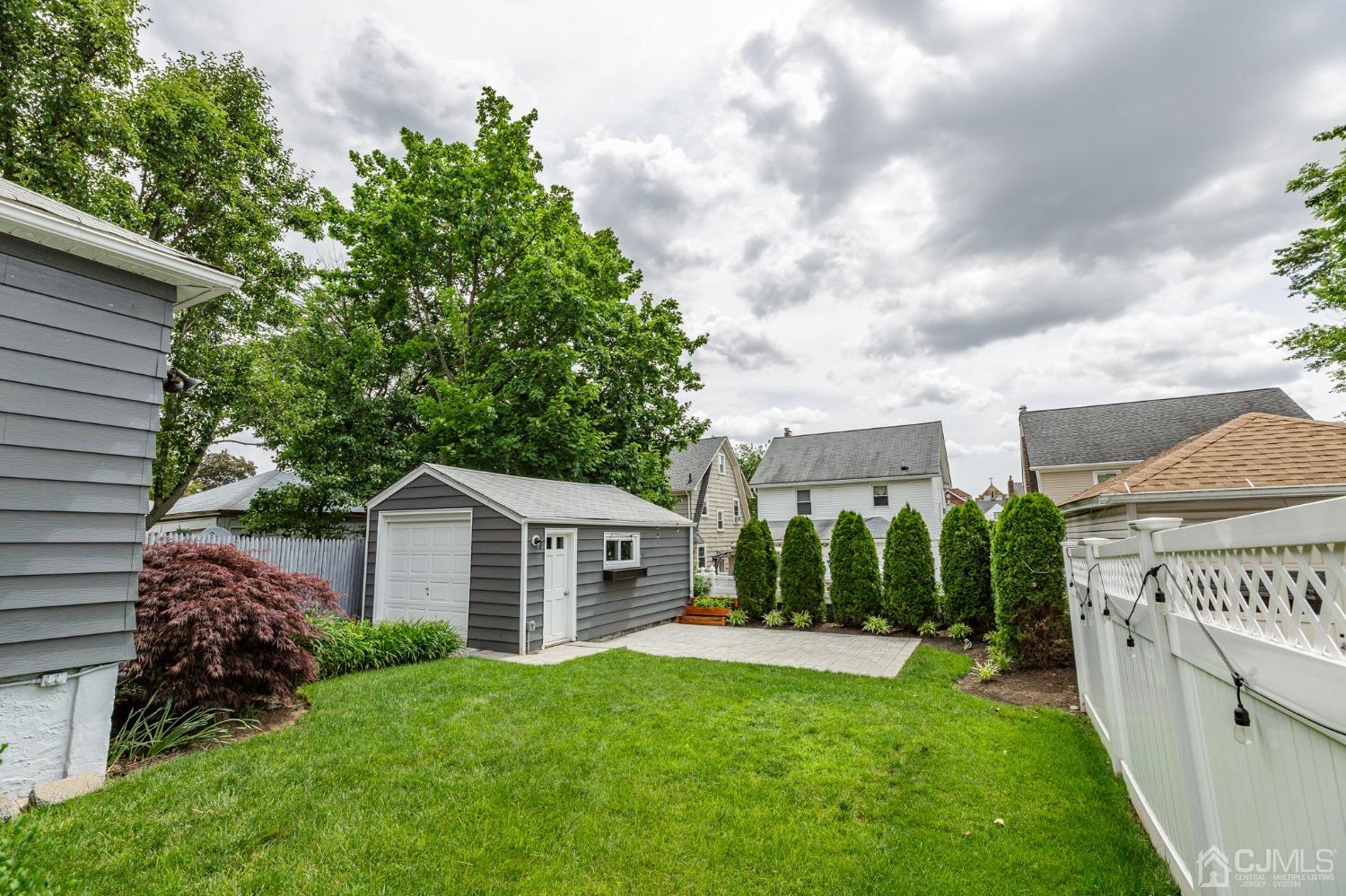 215 Hillside Road Elizabeth, NJ 07208 - Photo 31 of 37 a view of a house with backyard and garden