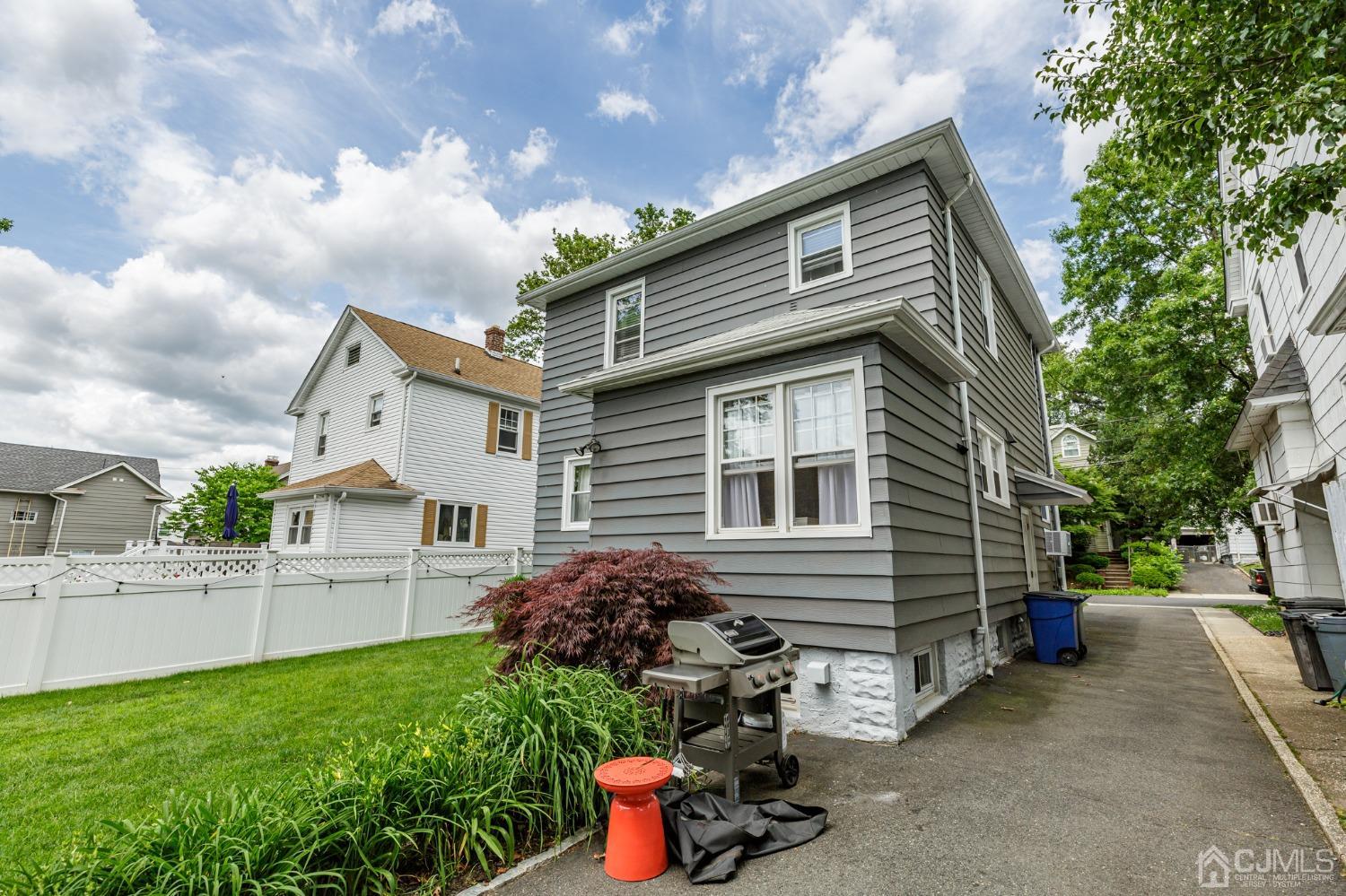 215 Hillside Road Elizabeth, NJ 07208 - Photo 34 of 37 a front view of a house with a yard