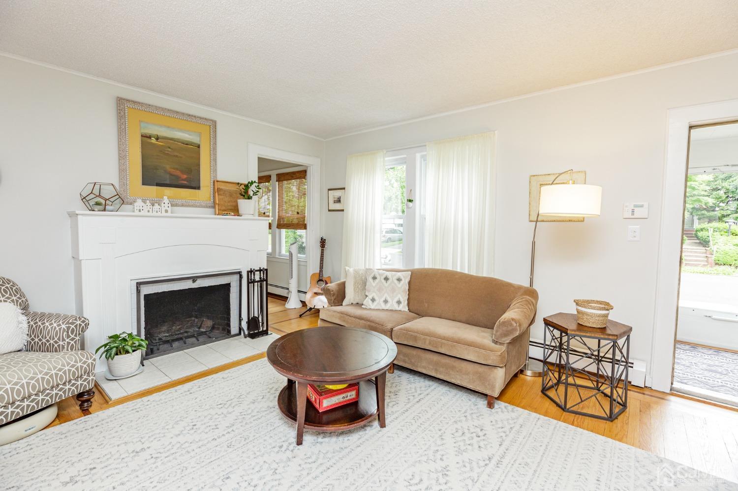 215 Hillside Road Elizabeth, NJ 07208 - Photo 5 of 37 a living room with furniture and a fireplace