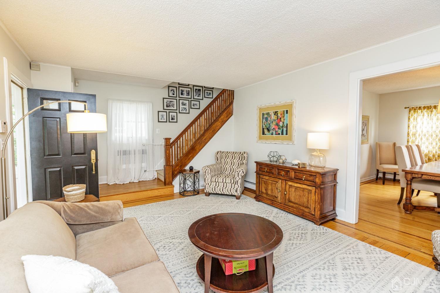 215 Hillside Road Elizabeth, NJ 07208 - Photo 7 of 37 a living room with furniture and a wooden floor