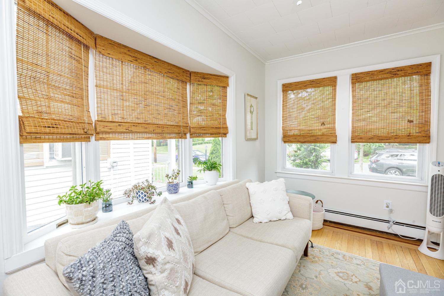 215 Hillside Road Elizabeth, NJ 07208 - Photo 9 of 37 a living room with furniture and a large window