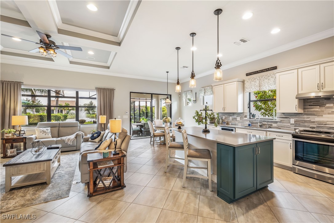 12894 Epping Way Fort Myers, FL 33913 - Photo 12 of 49 a open kitchen with stainless steel appliances granite countertop a stove and a view of dining table