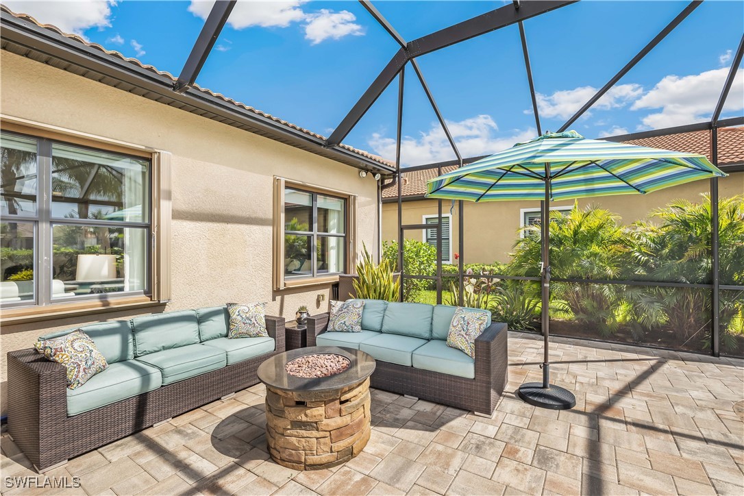 12894 Epping Way Fort Myers, FL 33913 - Photo 31 of 49 a view of a patio with couches under an umbrella