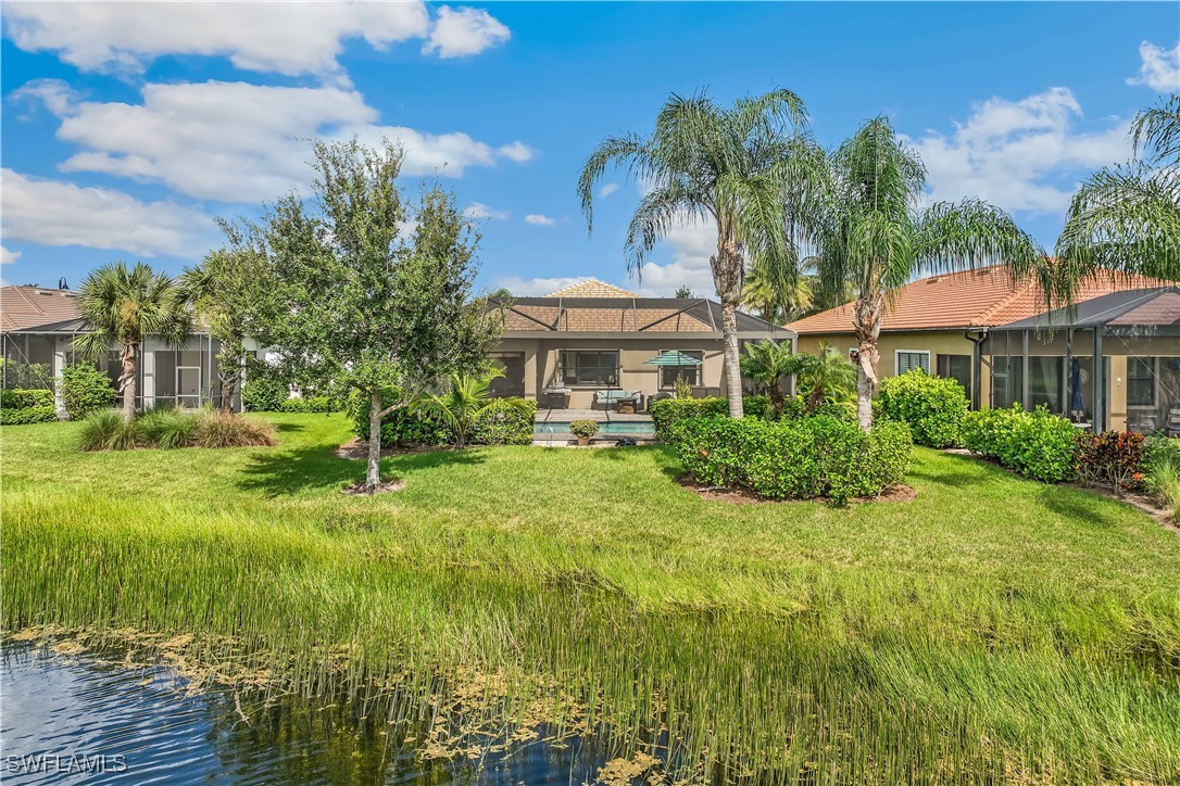 12894 Epping Way Fort Myers, FL 33913 - Photo 37 of 49 a view of a big yard with plants and a fountain