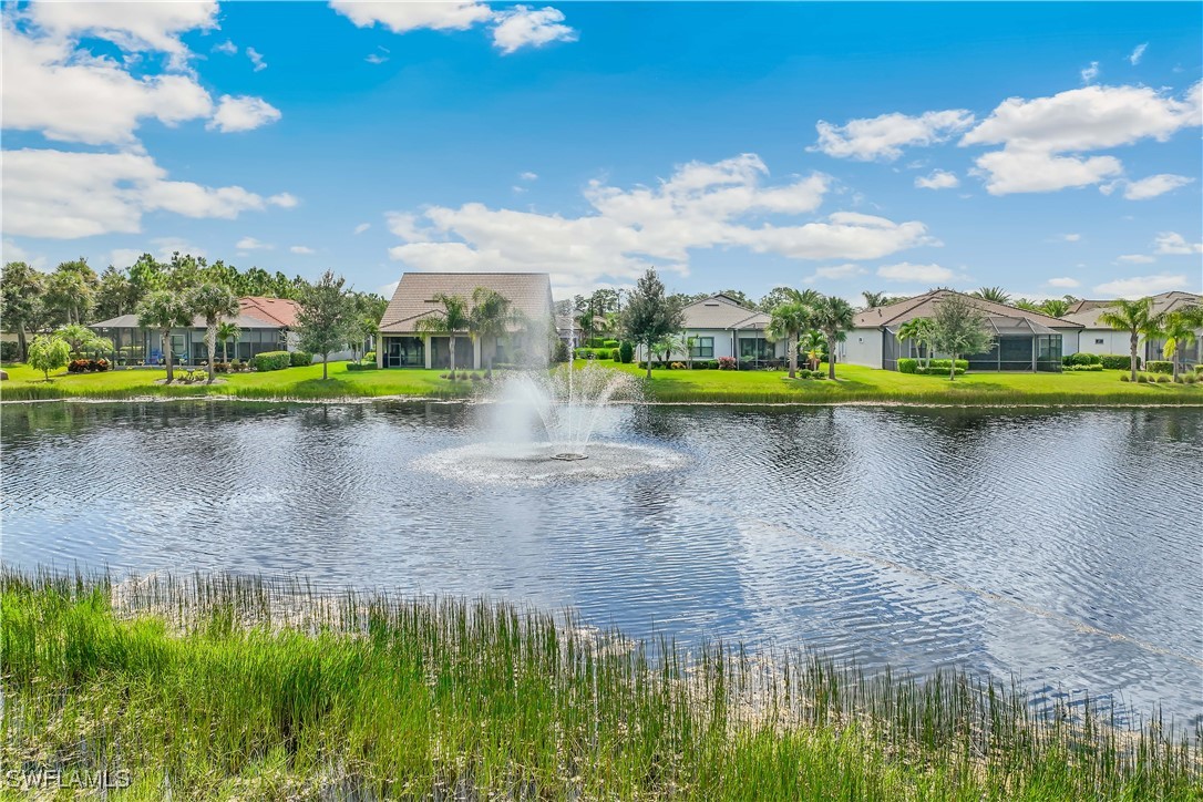 12894 Epping Way Fort Myers, FL 33913 - Photo 39 of 49 a view of a lake with houses in the back