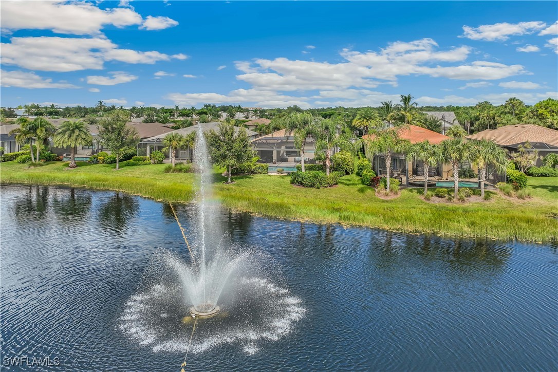 12894 Epping Way Fort Myers, FL 33913 - Photo 4 of 49 a view of a lake with houses in the back