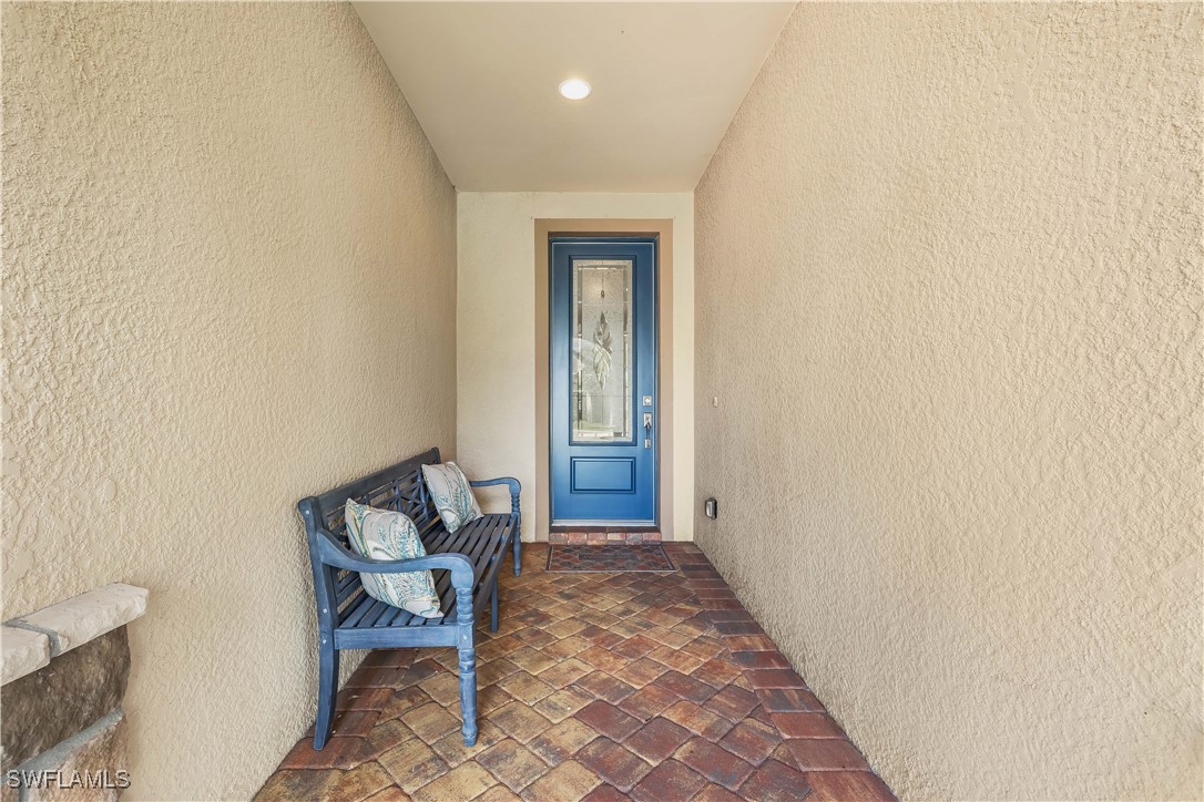 12894 Epping Way Fort Myers, FL 33913 - Photo 6 of 49 a view of a hallway with wooden floor and a door