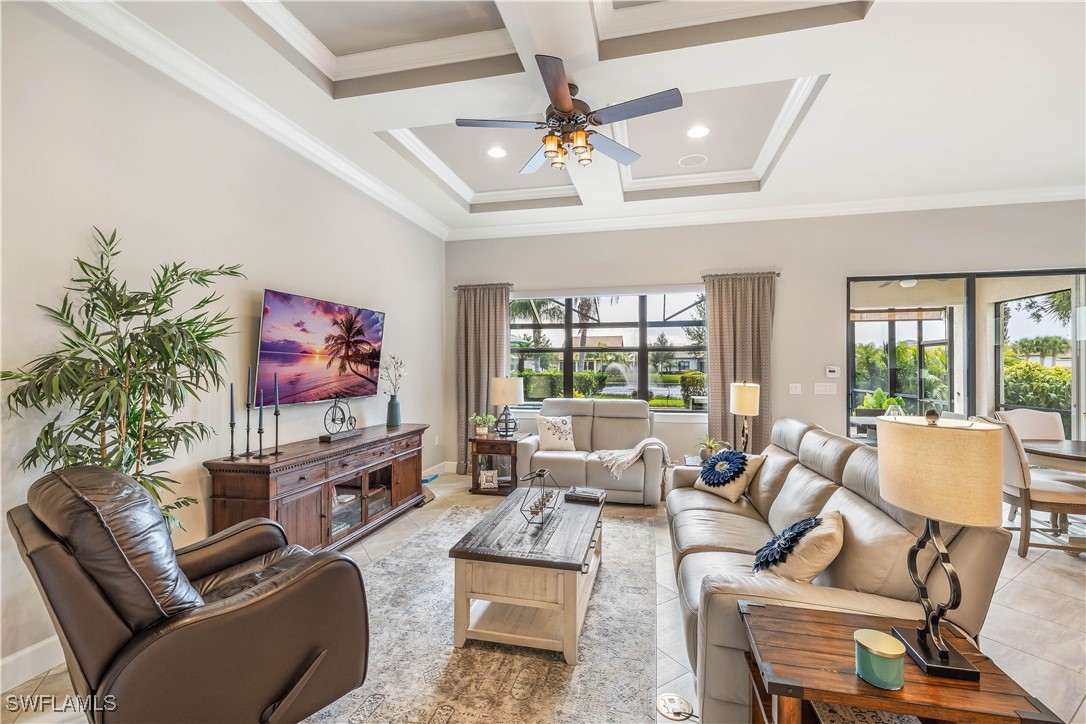 12894 Epping Way Fort Myers, FL 33913 - Photo 9 of 49 a living room with furniture a flat screen tv and a large window