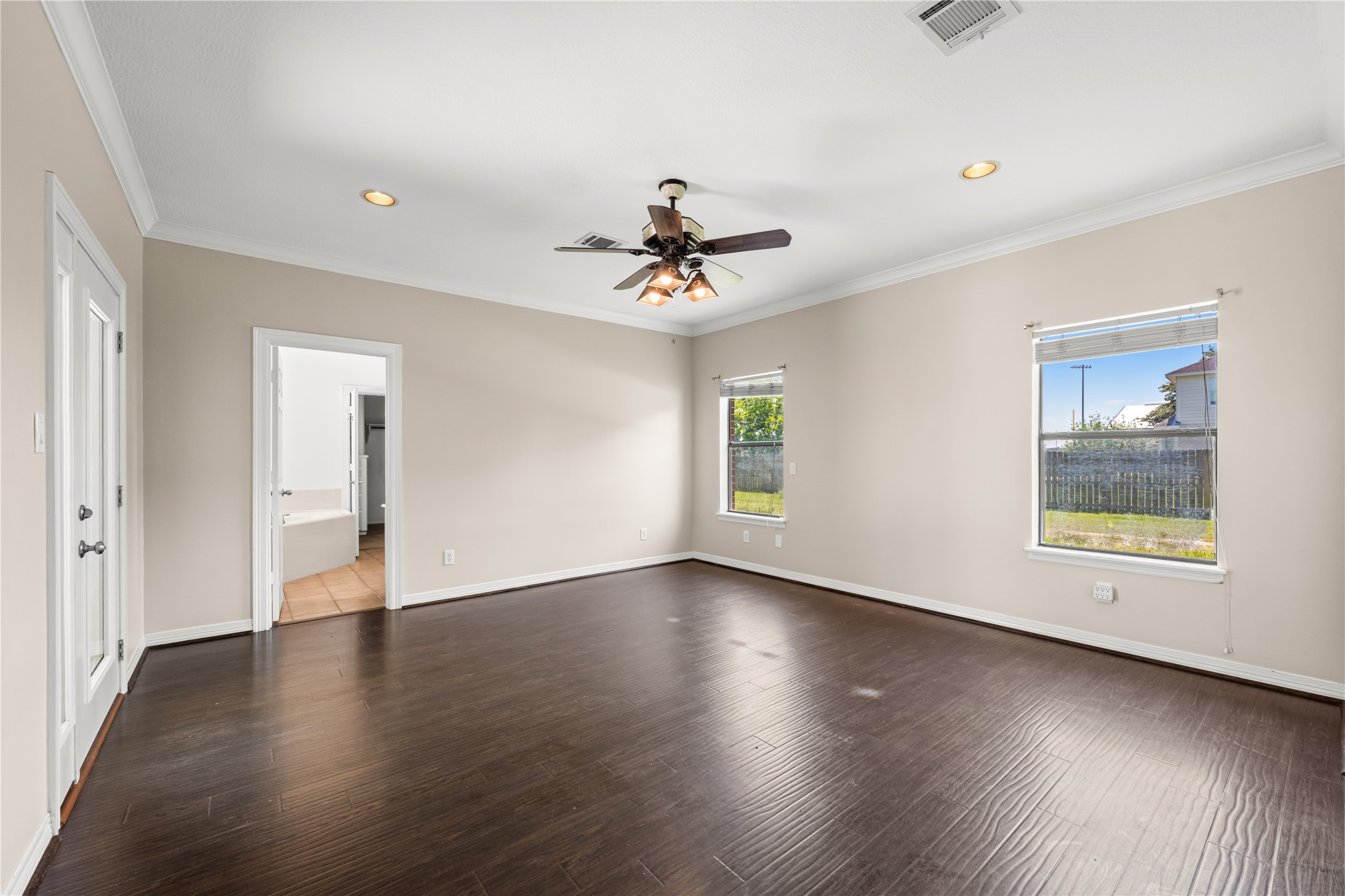 20240 Cypress Rosehill Road Tomball, TX 77377 - Photo 24 of 26 wooden floor in an empty room with a window