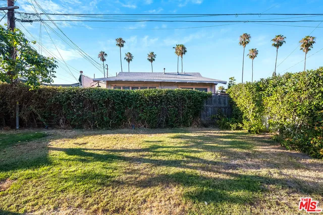 a view of a swimming pool with a yard