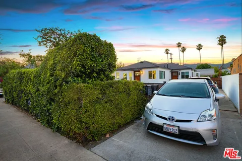 a car parked in front of a house