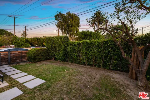 a view of a backyard with a garden