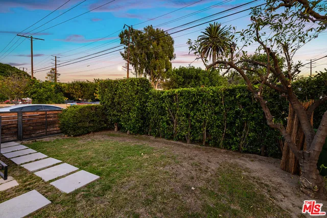 a view of a backyard with a garden
