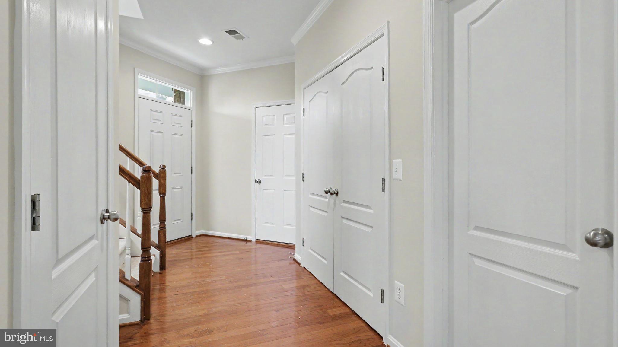42371 Trellis Square Brambleton, VA 20148 - Photo 12 of 70 Inviting hallway with warm wood floors.