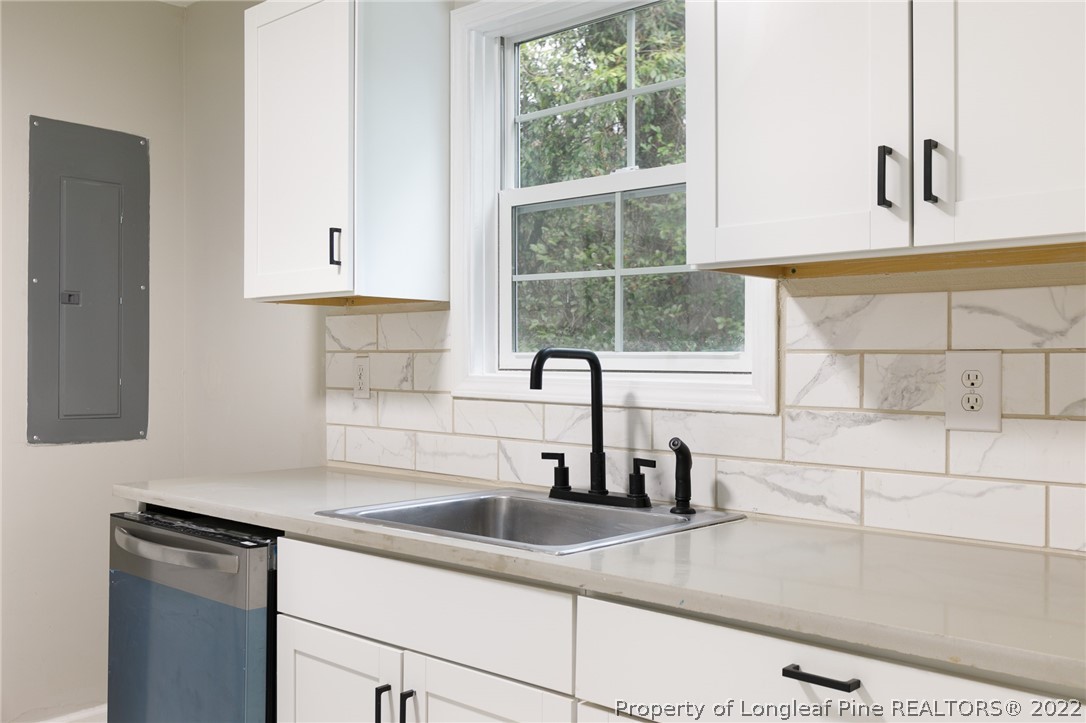 595 Midway Road Aberdeen, NC 28315 - Photo 11 of 22 a kitchen with a sink and a window