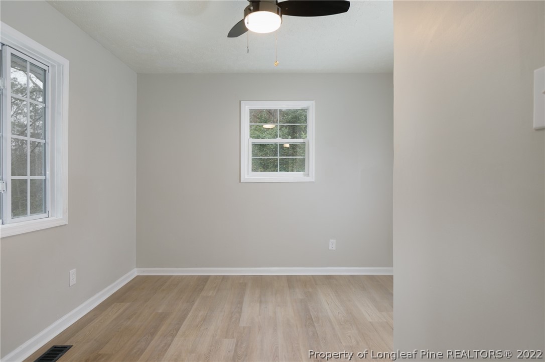 595 Midway Road Aberdeen, NC 28315 - Photo 13 of 22 an empty room with a window