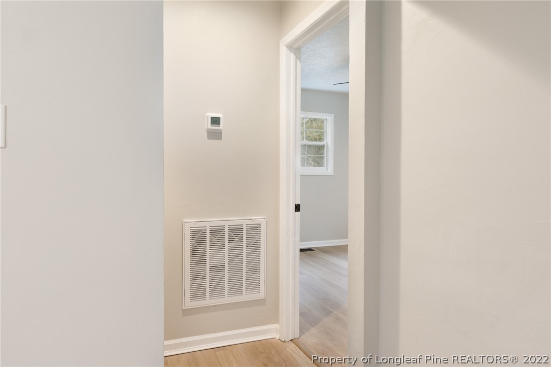 595 Midway Road Aberdeen, NC 28315 - Photo 15 of 22 a view of an empty room with windows