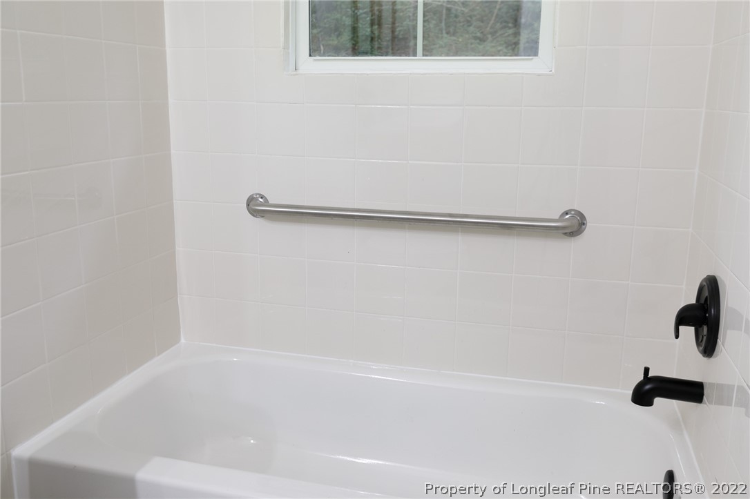 595 Midway Road Aberdeen, NC 28315 - Photo 19 of 22 a bathroom with a shower