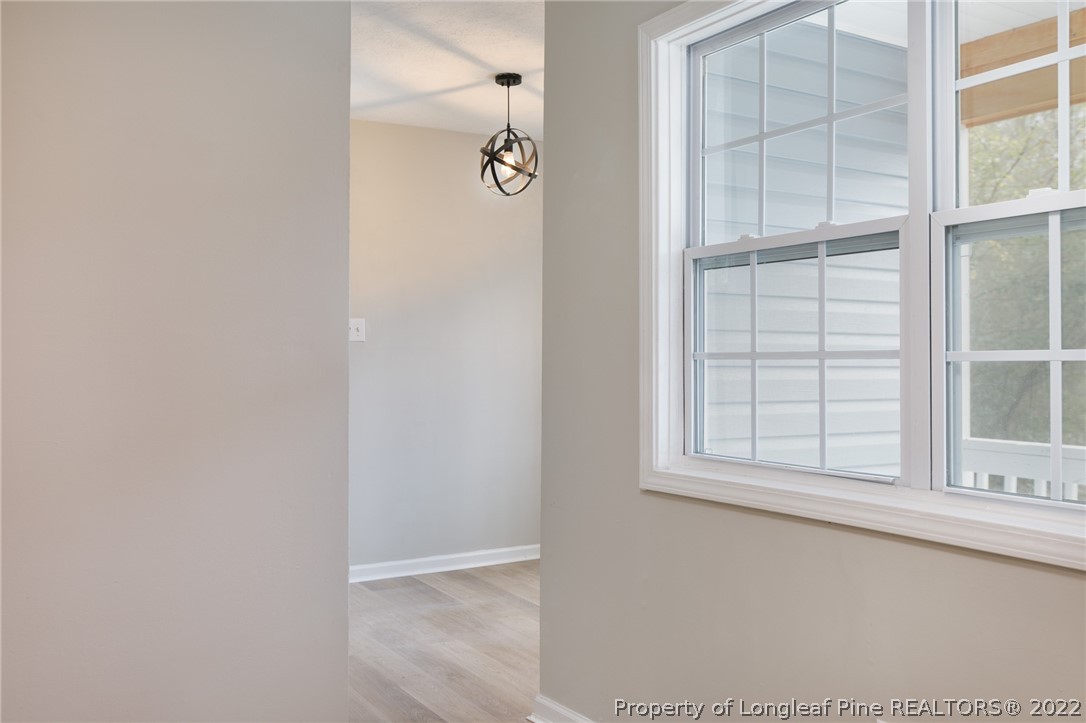 595 Midway Road Aberdeen, NC 28315 - Photo 6 of 22 an empty room with windows