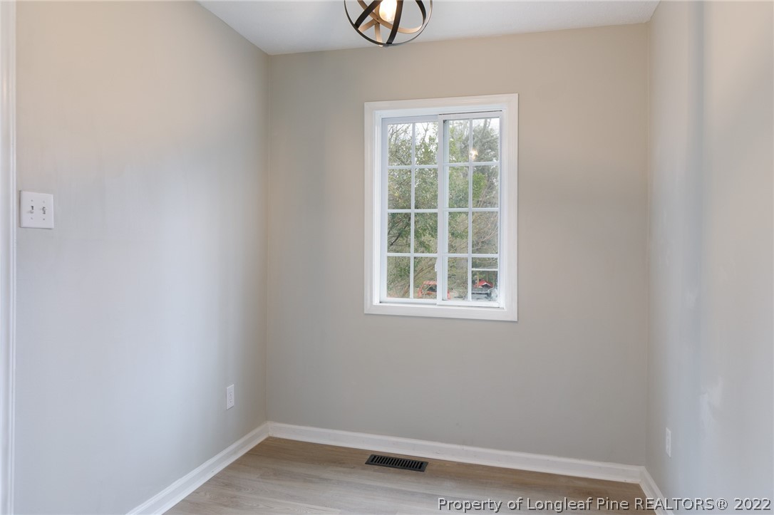 595 Midway Road Aberdeen, NC 28315 - Photo 7 of 22 an empty room with a window