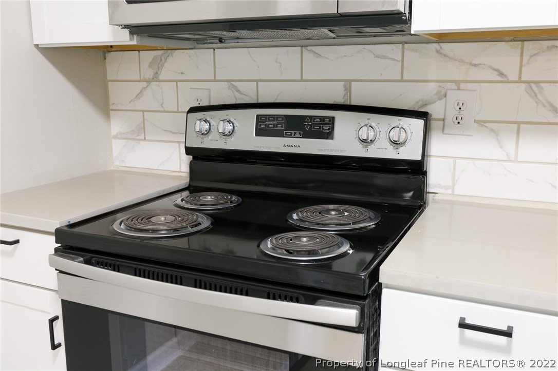 595 Midway Road Aberdeen, NC 28315 - Photo 10 of 22 a stove top oven sitting inside of a kitchen