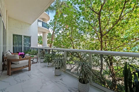 a view of a swimming pool with outdoor seating