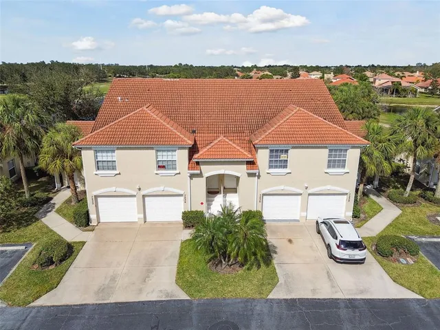 an aerial view of a house with a lake view