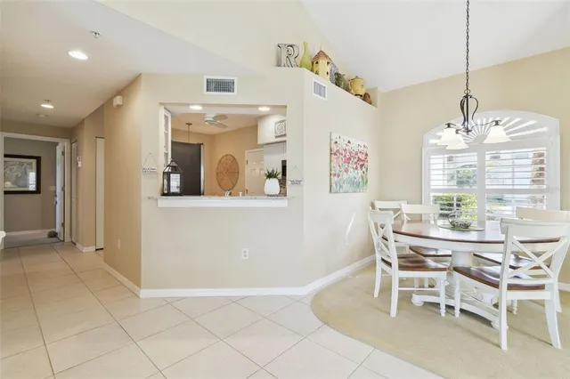 a kitchen with white cabinets appliances and a sink