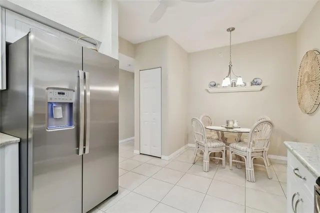 a kitchen with a sink and a refrigerator