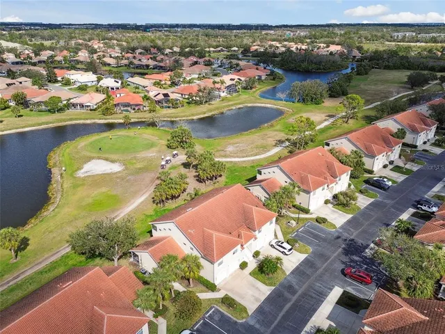 a front view of a building with sitting space and garden