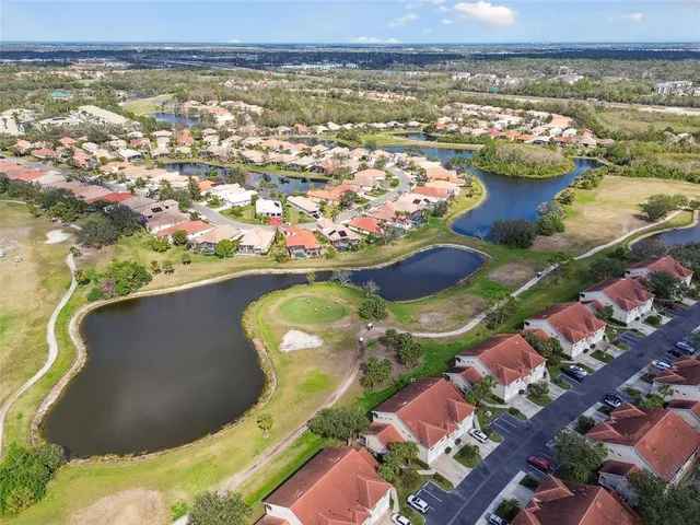 an aerial view of a house with swimming pool