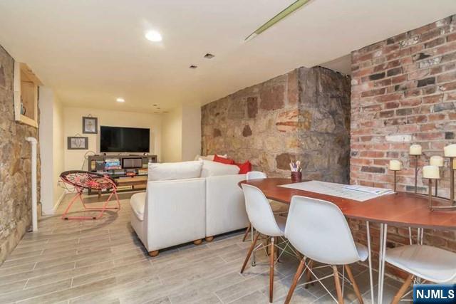 48 Stelfox Street Demarest, NJ 07627 - Photo 16 of 19 a living room with furniture and a flat screen tv