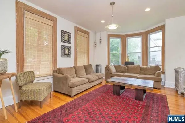 a living room with furniture and a rug